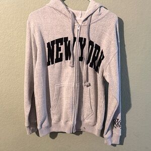 New York Zip-Up Hoodie in Light Gray with Black Lettering